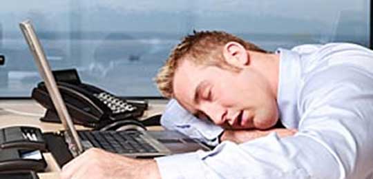man-sleeping-computer